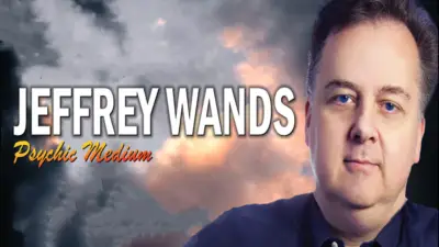 Portrait of Jeffrey Wands, Psychic Medium, with a cloudy sky background.